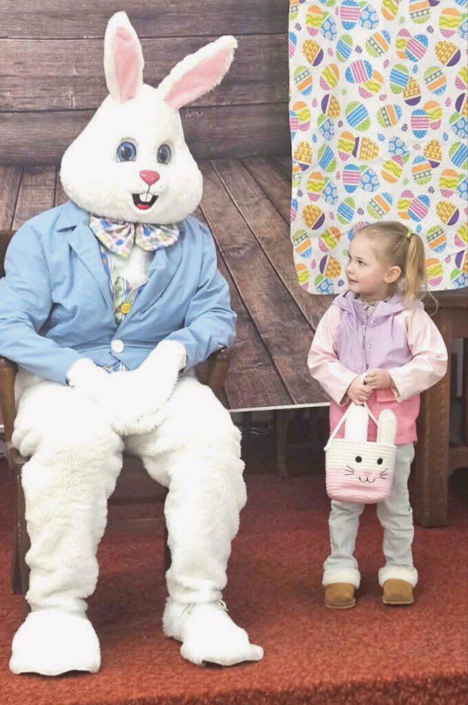Easter Bunny with Easter egg hunt participant