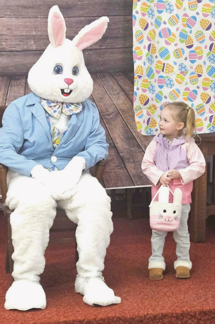 Easter Bunny with Easter egg hunt participant