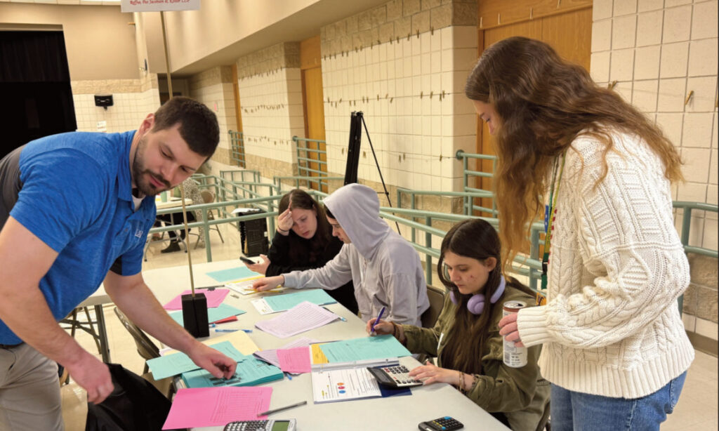 Group of people practicing financial literacy
