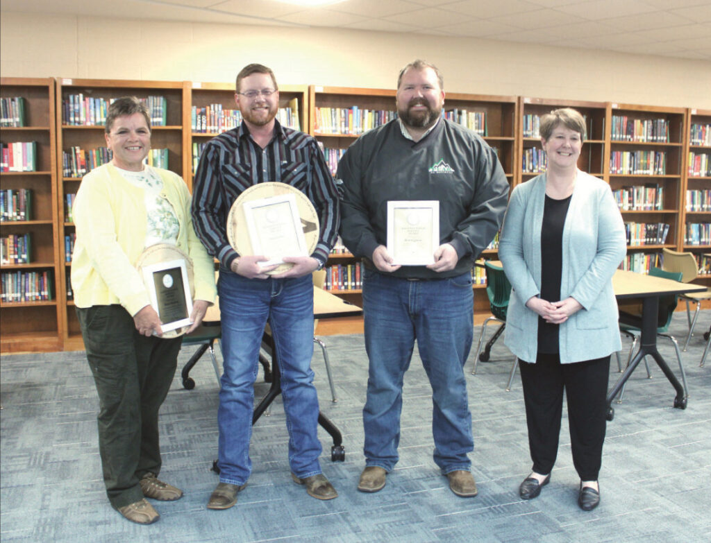 Pecatonica Area School District Board of Education board members Grace Knutson, Cory DeSmet, and Nick Huffman did not run again for their seats. They all came onto the board together six years ago. Dr. Scott gave them plaques and decorations made from the former elementary school gymnasium. Knutson encour- ages everyone to run for the board to help support the school district.