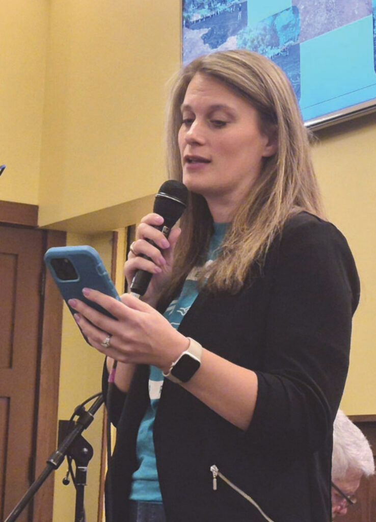 Marsha Crooks helps welcome the crowd