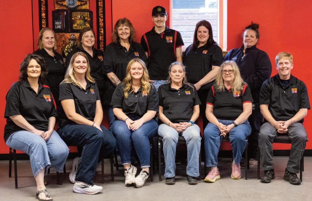 Names from Left to Right Back Row: Nicole Deckert, Chasity Gann-Vogel, Peggy Hittesdorf, Will Doescher, Brianna Nutter, Erin Oimoen; Front Row: Caprice Massey, Casandra Doescher, Ellery Massey, Janine Tracy, Pam Lauper, Rob Massey. Not Pictured: Cody Goninen, Kyssah Gann, Bob Hittesdorf, Angela Olson, Tyler Pull, Ryan Zimmerman, and Jennifer Jayne. Photo Credit: Ellery Massey Photography