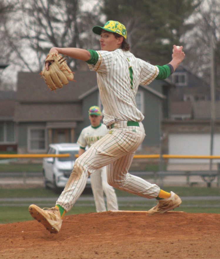 Austin Enloe delivers a pitch during a Six Rivers conference game against Highland. The Vikings handled the Cardinals with a 7-2 victory.