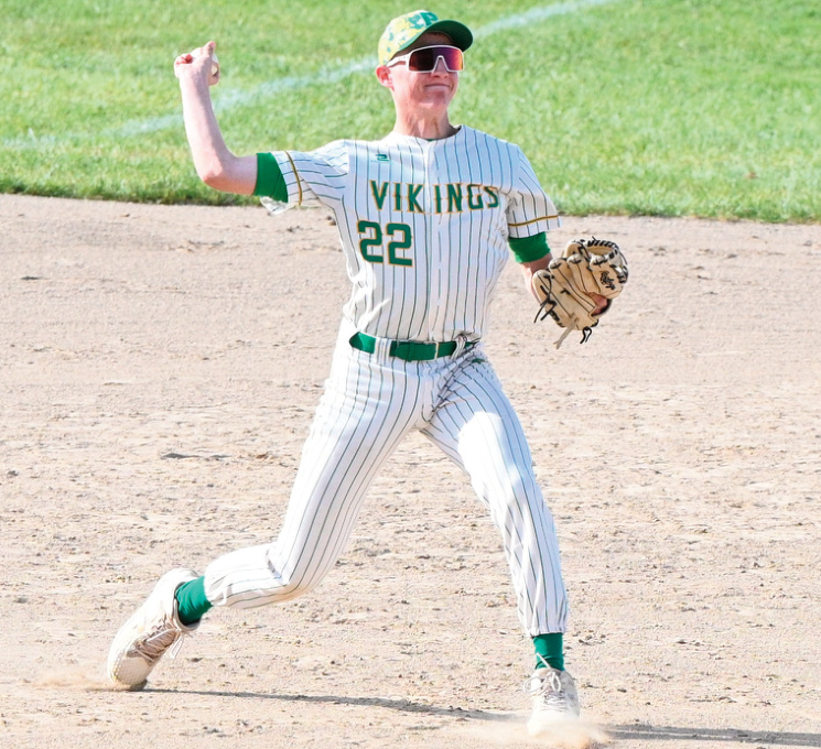 Third basemen Luke Leonard makes a throw to first. Photo by Anita Schmid.