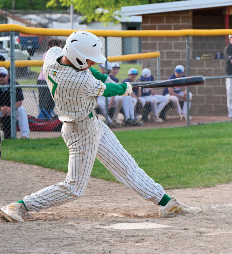 Linden Ula takes a swing at a pitch. Photo by Anita Schmid.