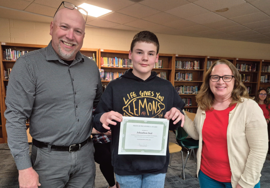 A photo of Johnathon Deal holding a certificate
