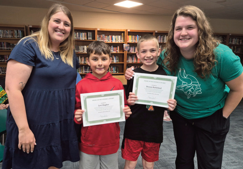 A photo of Levi Hughes and Bryson Burkeland holding a certificate
