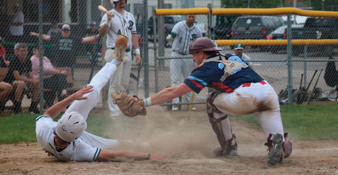 Hunter Enloe slides into home trying to avoid a tag from the Arena Aces catcher. Photo by Kayla Barnes.