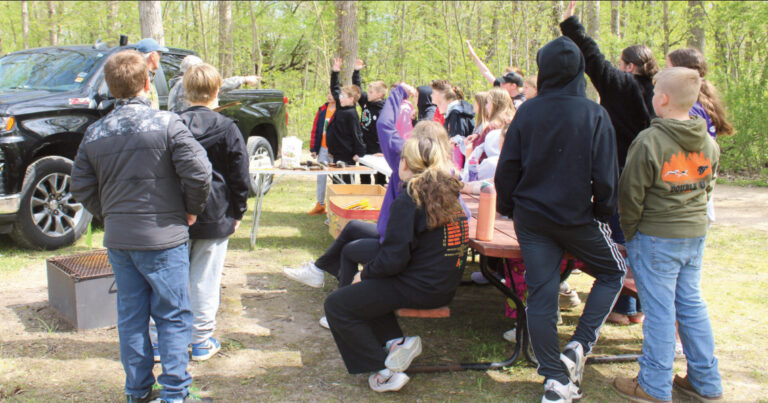 Fifth grade students from Argyle spent their Tuesday, May 5 in Woodford at Blackhawk Lake Memorial Park for Earth Day. Here they learn about different animal calls and tracks. Photo by Kayla Barnes.