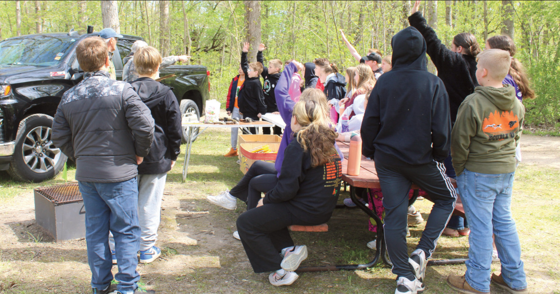 Fifth grade students from Argyle spent their Tuesday, May 5 in Woodford at Blackhawk Lake Memorial Park for Earth Day. Here they learn about different animal calls and tracks. Photo by Kayla Barnes.