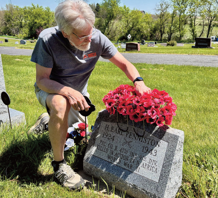 Garry Rossing at a grave stone