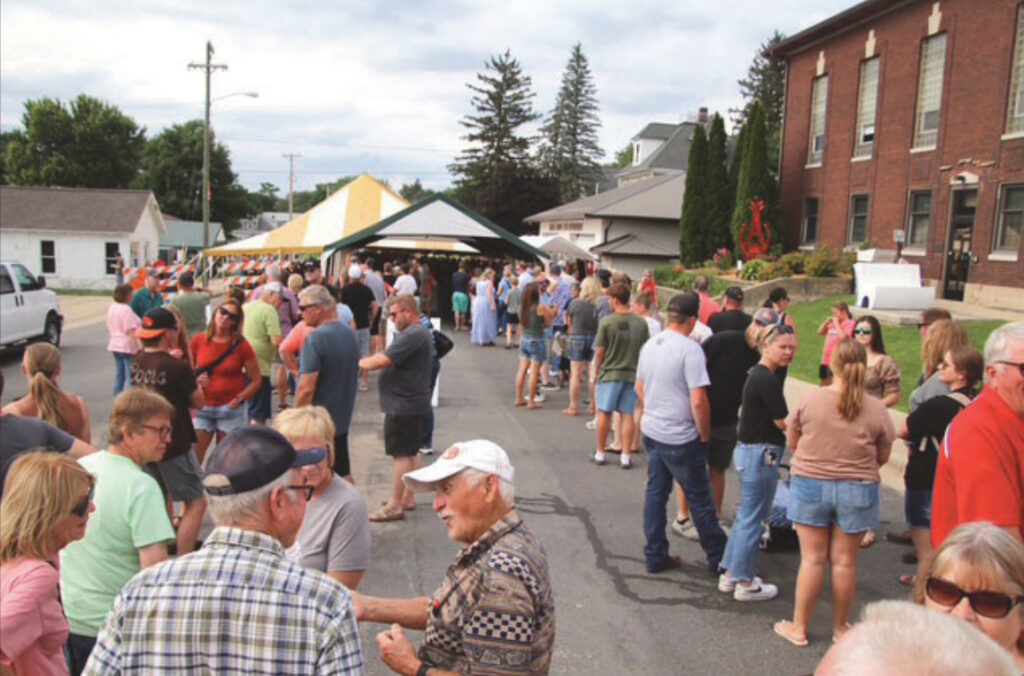 People wandering through the Argyle Open Market