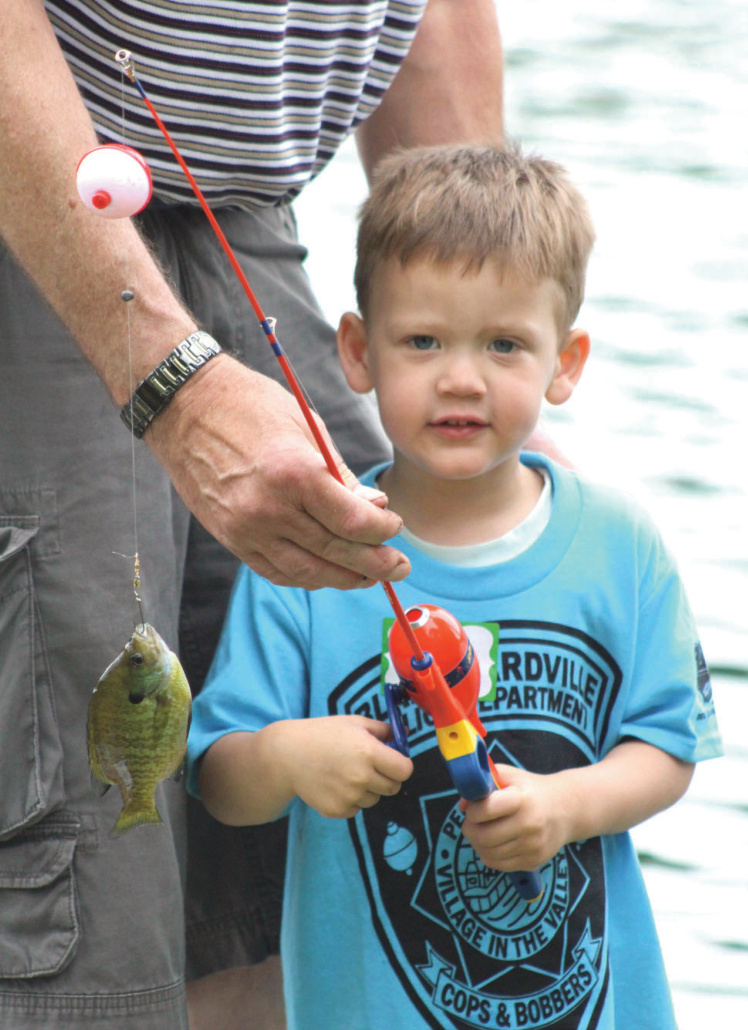 Kid holding fishing pole