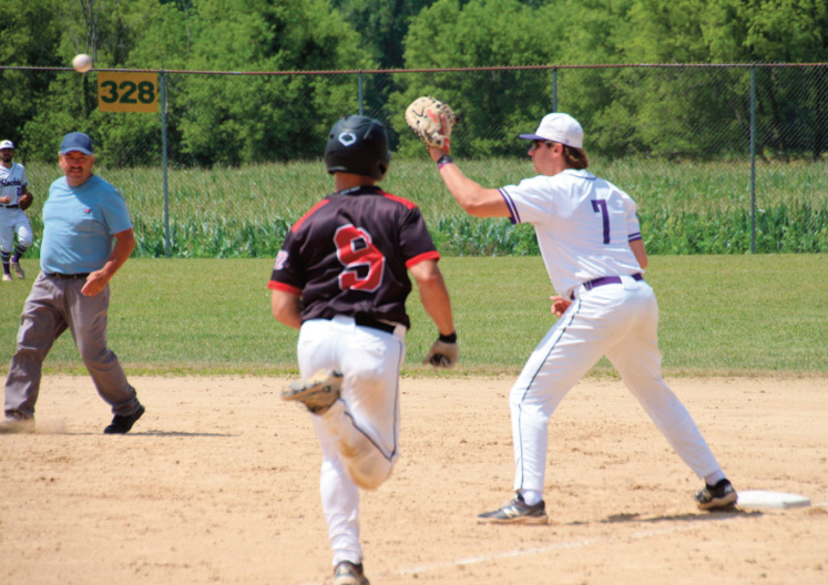 Rockies first baseman Chase Ignatius waits for the ball as Knights Dom McVay heads down the line. Photo by Shelly Reilly Roh.
