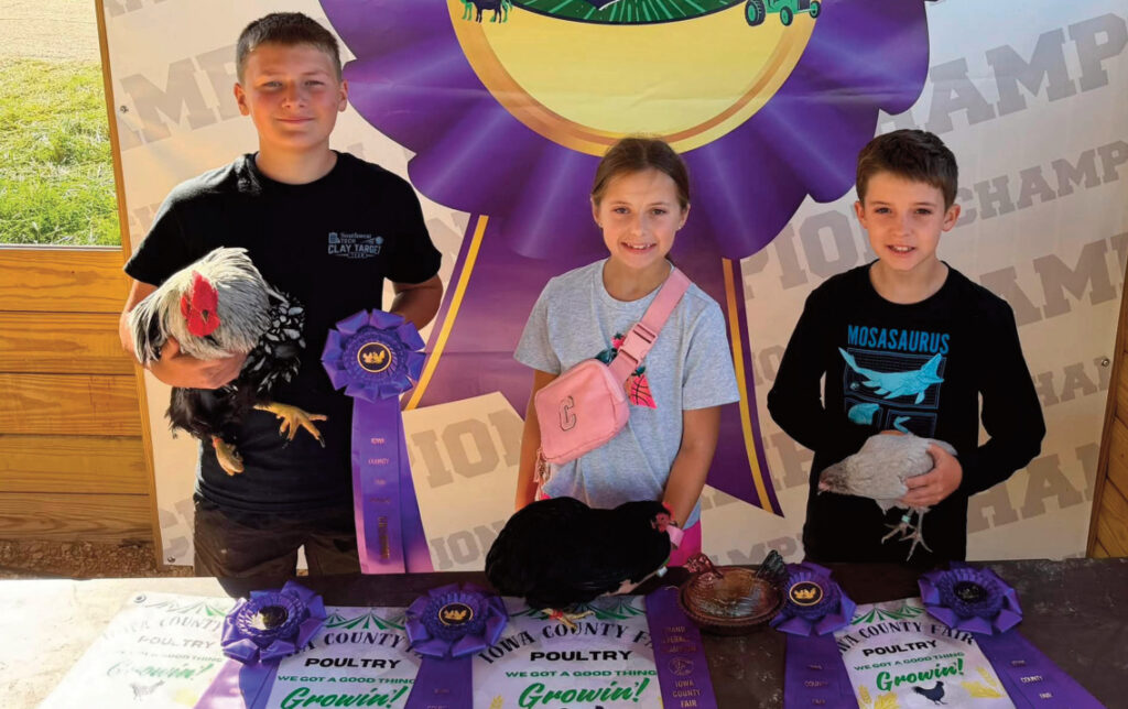 The Iowa County Fair took place in Mineral Point and participants from the area were there. Pictured is Evan Olson, Callee Flannery and Cash Flannery, who together received several awards for their poultry exhibits. See more participants and their exhibits on pages 8 & 9. Photo by Melissa Leonard-Flannery.
